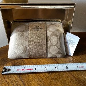 New with tags and box. Coach wristlet.